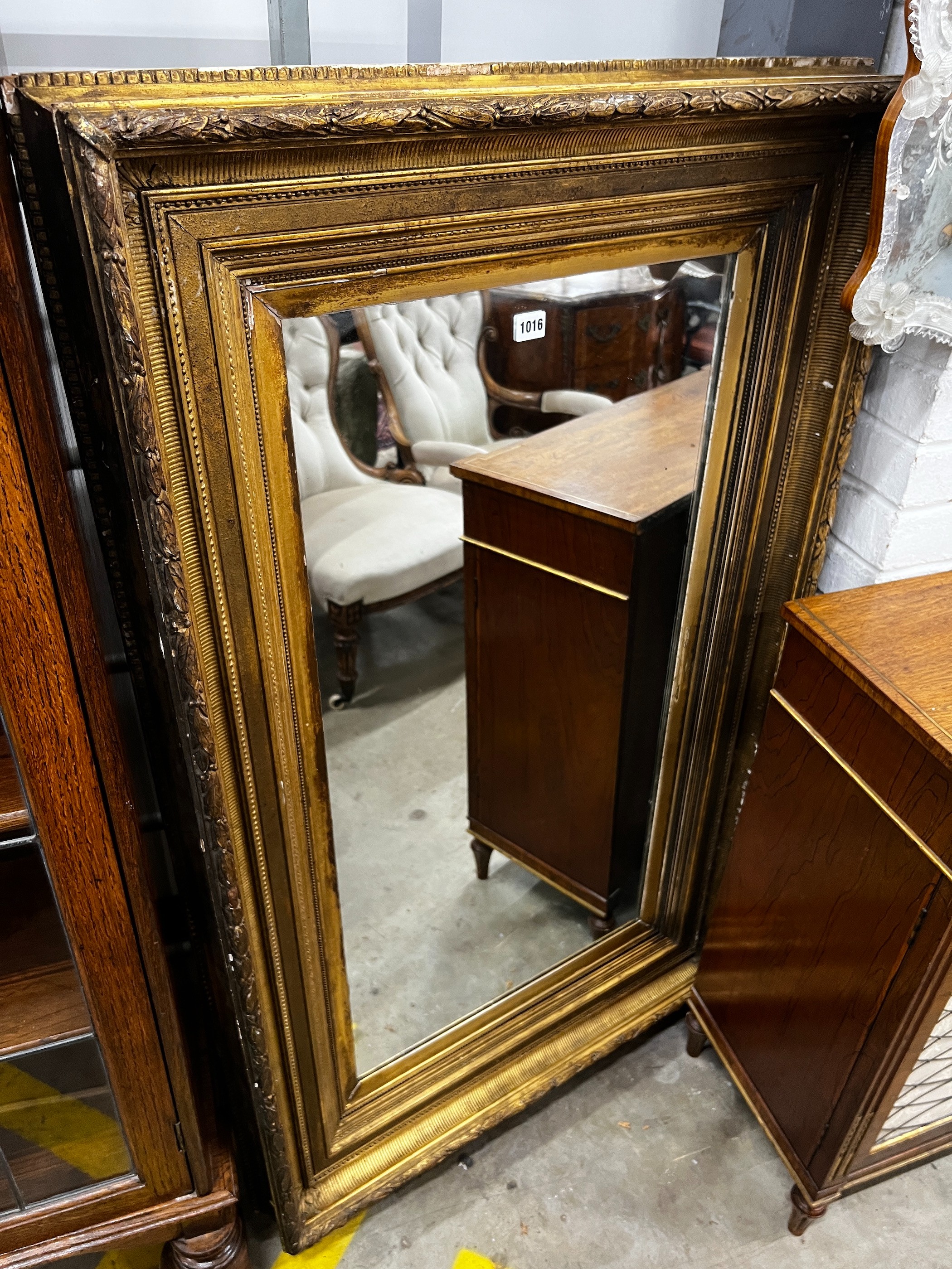 A Victorian rectangular giltwood and composition wall mirror (converted picture frame), 134cm x 80cm.